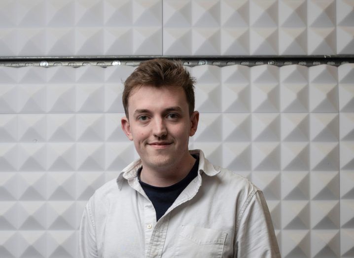 Headshot of Joe Carroll of UCC who led the quantum study. He is wearing a white shirt and standing in front of a white wall.