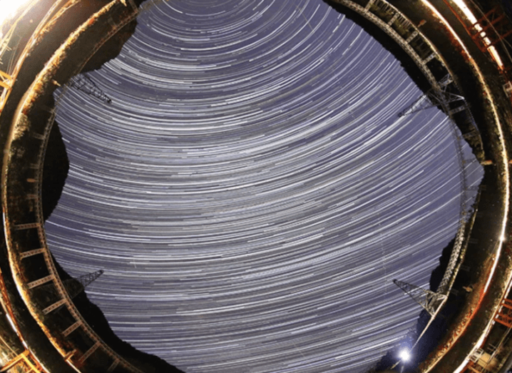 360 degree image of the night sky appearing to show gravitational waves detected by telescopes.