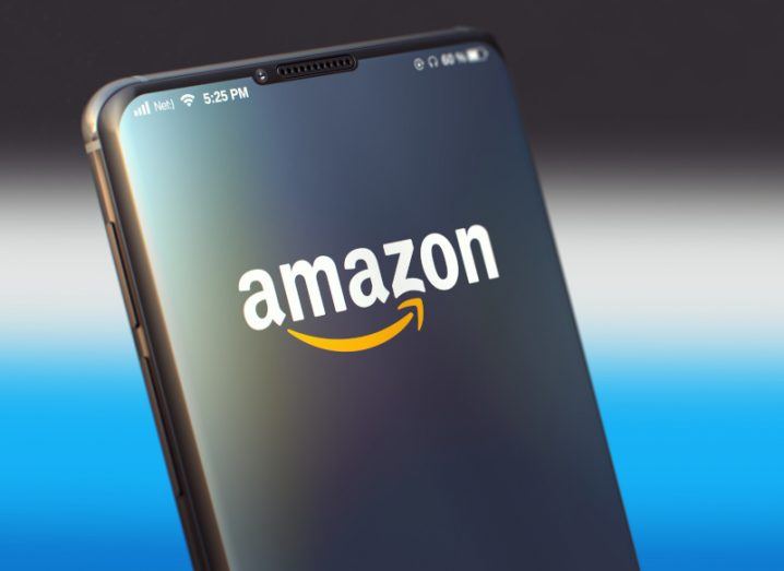 The Amazon logo on the front of a smartphone screen.