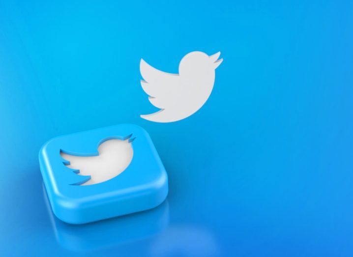 The Twitter logo on a blue square, with another Twitter bird logo above it in a blue background.