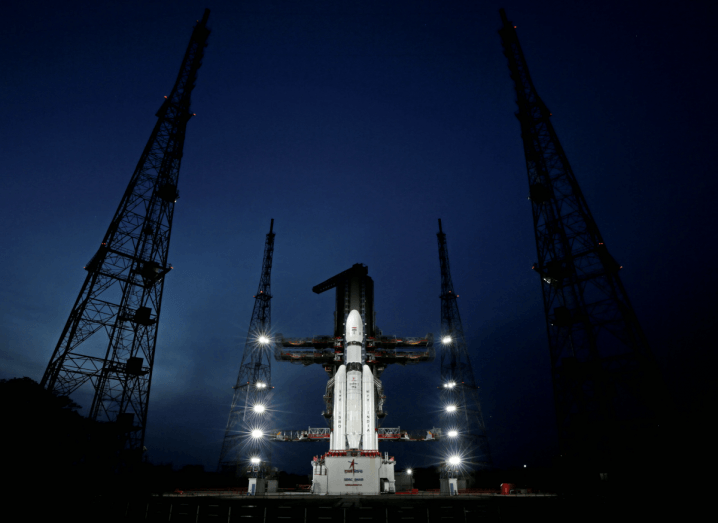 The Chandrayaan-3 mission rocket ready to launch from a site in the east coast of India. Night sky above.