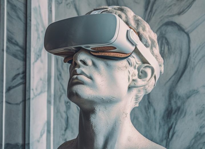 A renaissance statue wearing a VR headset in what appears to be a marble-walled room.