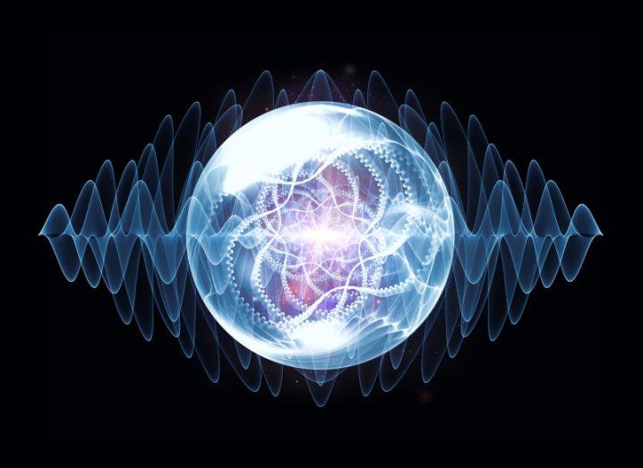 An illustration of a waves and a circular object like an atom that is bright in the middle of the image against the dark background.