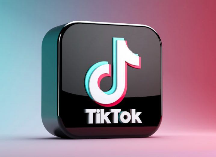 A black square with the TikTok logo on it, on a red and blue background.