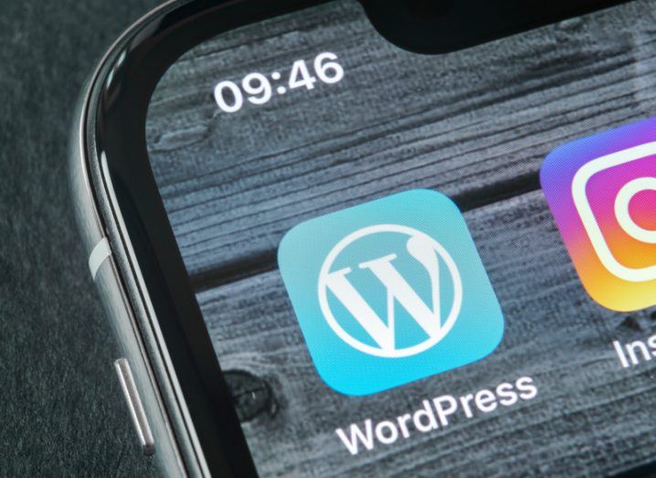 A close-up of the WordPress app logo on a smartphone.