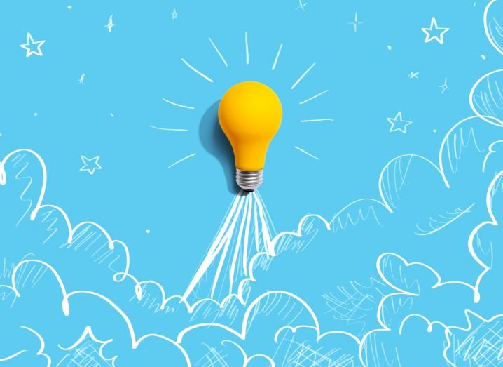 Illustration of a yellow bulb that's being propelled up like a rocket with drawings of clouds and stars around it. Stands for the Enterprise Ireland Pre-Seed Start Fund that helps early-stage start-ups grow.