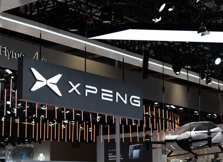 Logo of Xpeng, which just acquired assets from Didi, in a showroom.