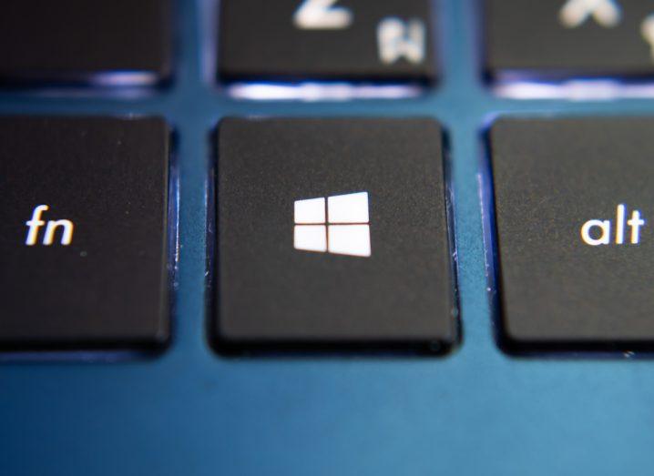 Close-up of the Windows key on a keyboard using Microsoft software. This key has to be pressed in order to access Cortana.