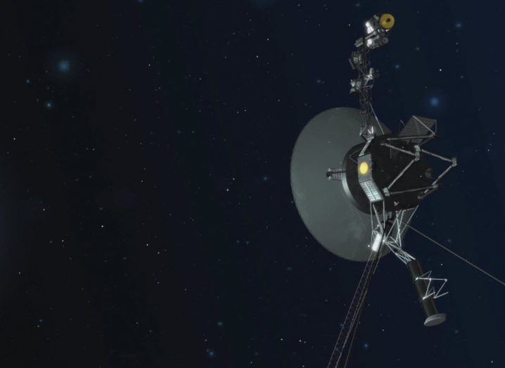 Artist's impression of the Voyager 2 spacecraft in interstellar space with faint stars in the background.