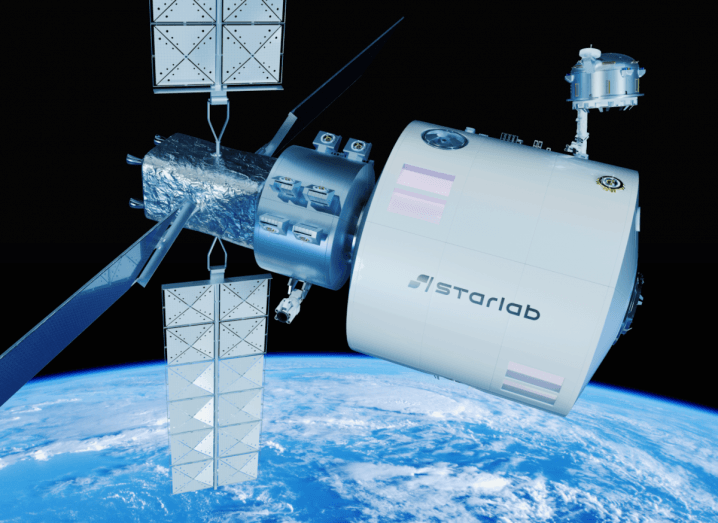 An artist's impression of Starlab, a space station in orbit around the Earth, which is visible in the background.