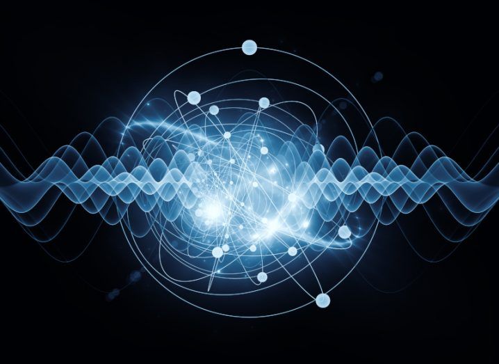 An illustration of an atom in blue and white light with swirling lines coming from the centre of the image on a dark background.