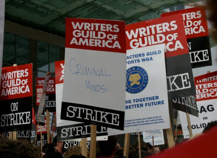 Multiple picket signs with the Writers Guild of America written on them. Taken during the Hollywood writer's strike.