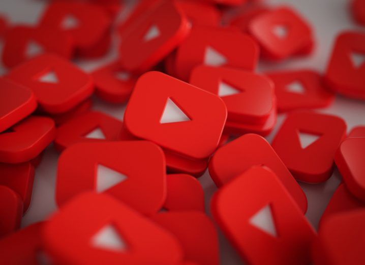 A pile of YouTube logos on a white surface.