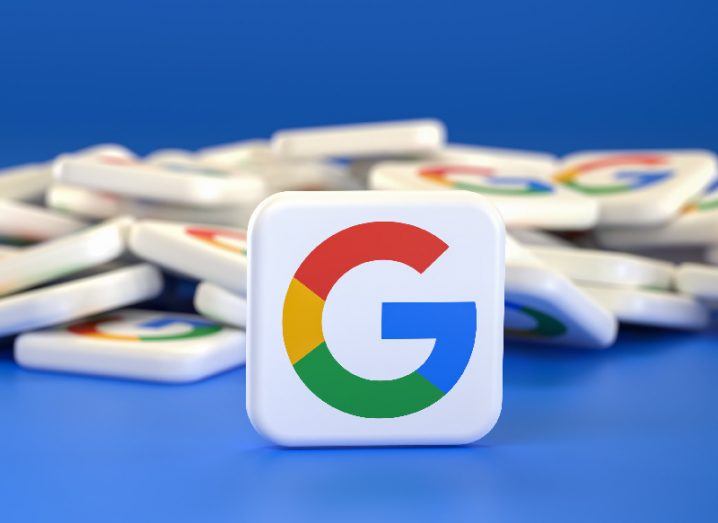 The Google logo on a white square in a blue background, with other logos in a pile behind it