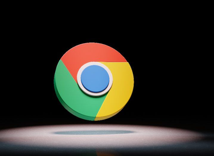 Illustration of the Google Chrome logo, floating in a spotlight with a black background.