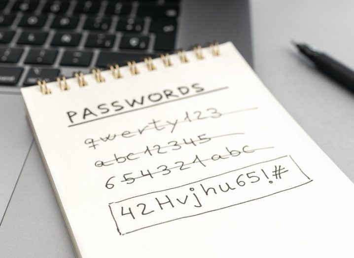 A page on top of a laptop, with different passwords written on it.