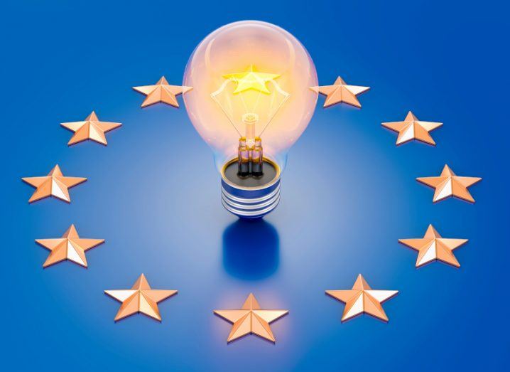 Illustration of a lightbulb on a blue surface with stars surrounding it, used to represent the EU flag.