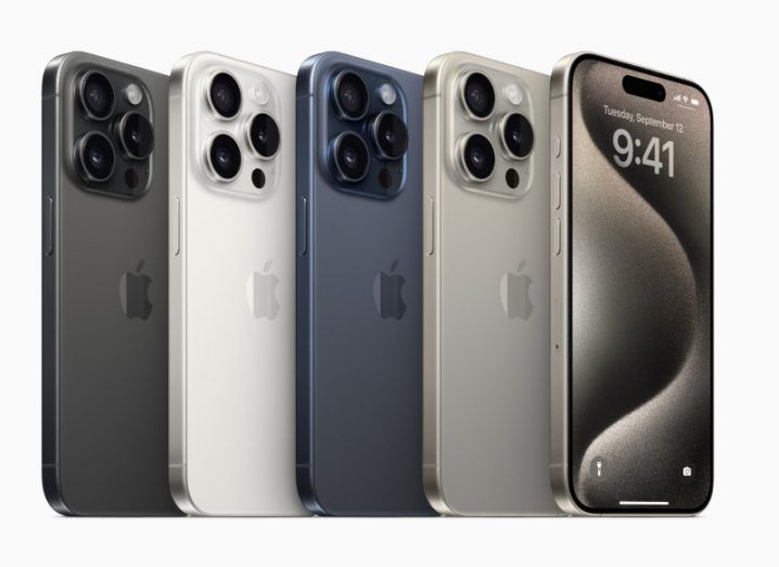 A row of different coloured iPhone 15 models, in a white background.