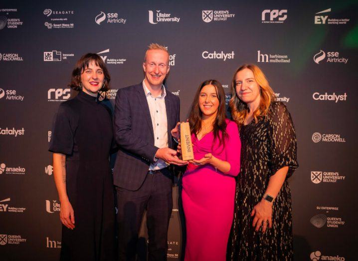 Three women and one man smile and pose at the Invent 2023 awards. Among them is Maebh Reynolds, the founder of overall winner of the night, GoPlugable.