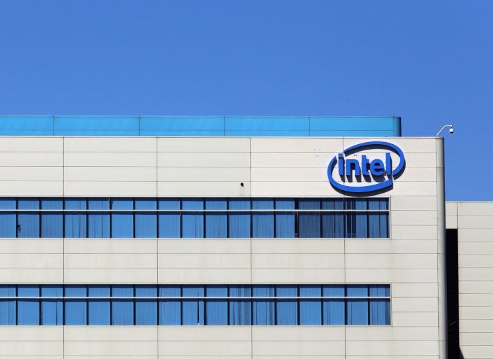 Intel logo on a building under a blue sky.