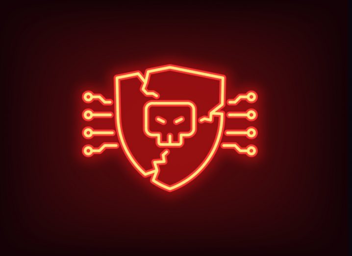 Illustration of a broken shield with a malicious skull icon in the centre. Used to represent AI cyberattacks.