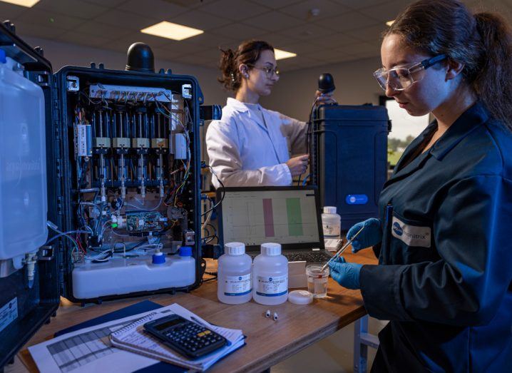 Two women testing a nitrate sensor in a lab.