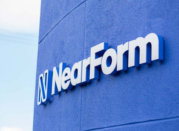 The NearForm logo in white on a blue wall.