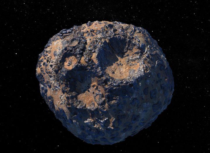 Illustration of the Psyche asteroid in space, with brown rock and grey metal fragments visible on the surface.