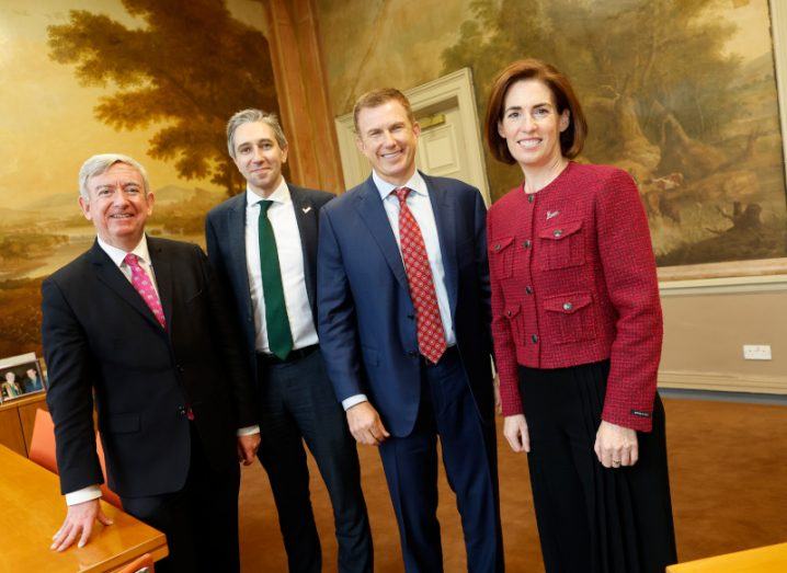 Three men and a woman standing together in a room. They are part of the Irish Government, the University of Galway and Medtronic.