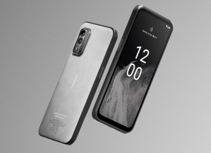 Two Nokia phones hovering in the air with a grey background.
