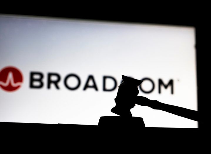 Silhouette of a gavel with the Broadcom logo in the background.