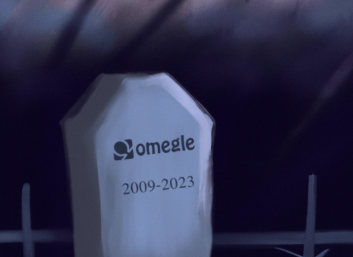 A gravestone with Omegle written on it and the dates 2009 to 2023 engraved under the name.