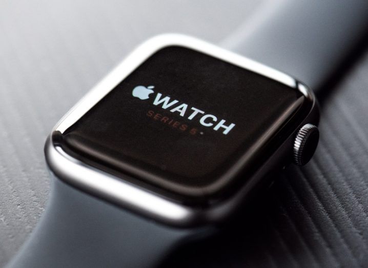 The Apple Watch on a grey background.