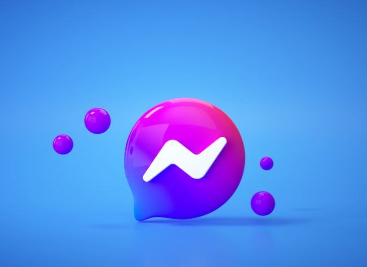 The Messenger logo on a blue surface and background, with small circles floating next to the logo.