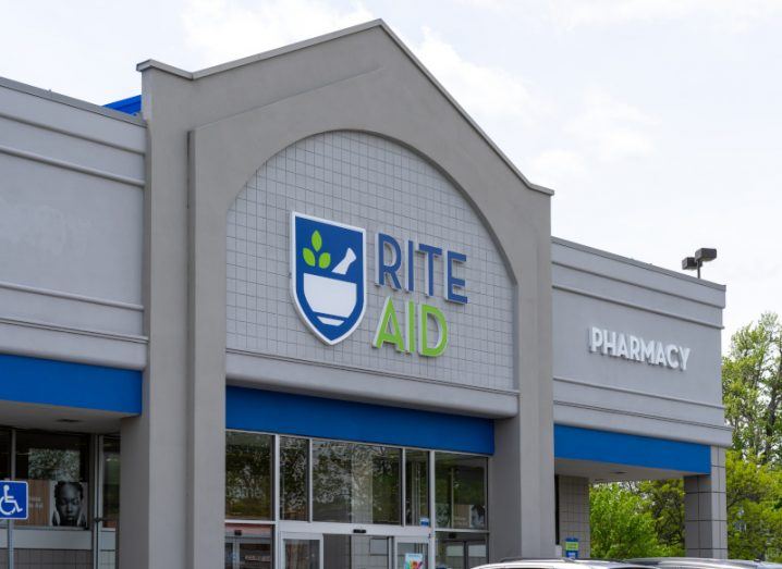 The outside of a pharmacy with the Rite Aid logo on the front.