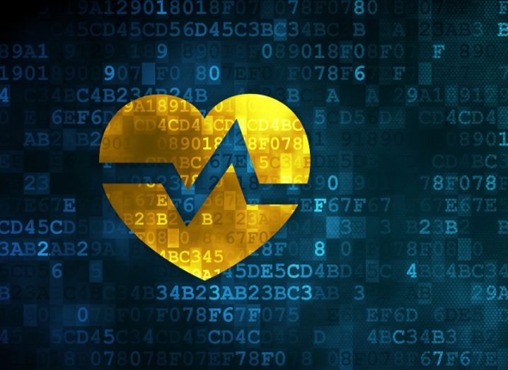 Illustration of a yellow heart with a monitor line going through it and sections of code in the background.