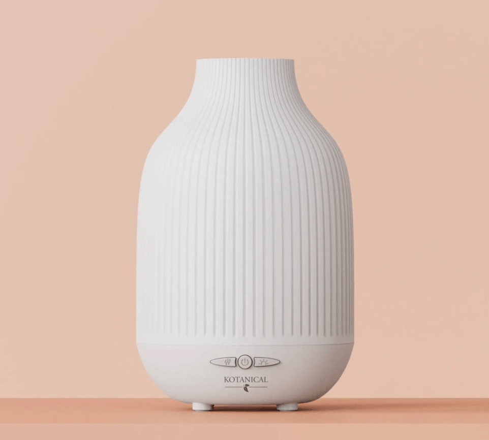 White oil diffuser on a beige background.