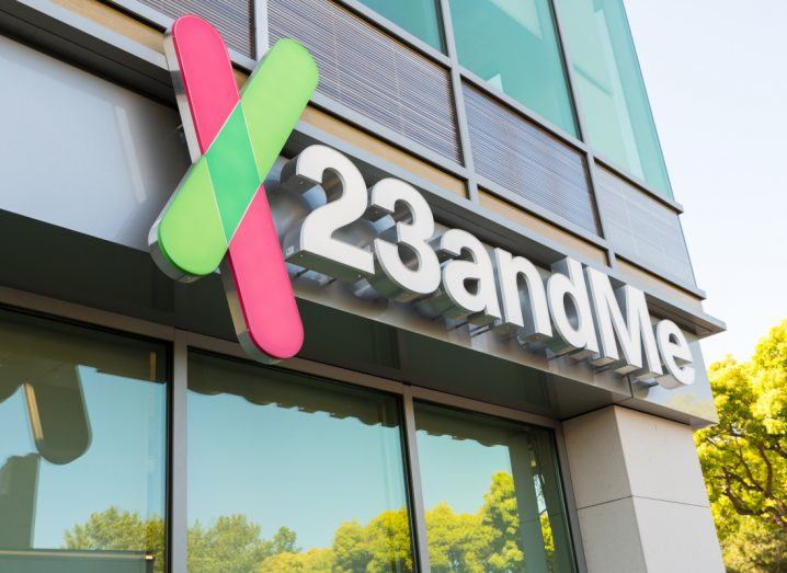 The 23andMe logo on a glass building during the day.