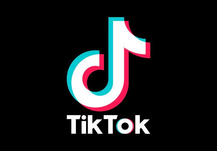 TikTok logo in a pitch black background.