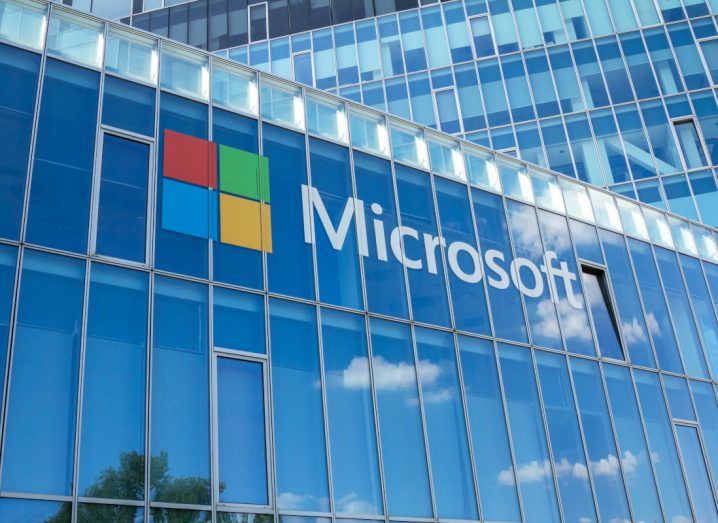 Microsoft logo on a glass building.