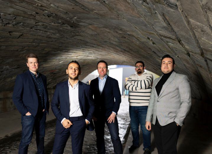 Five men standing together in a tunnel. They are part of iSchool and VentureWave Capital.