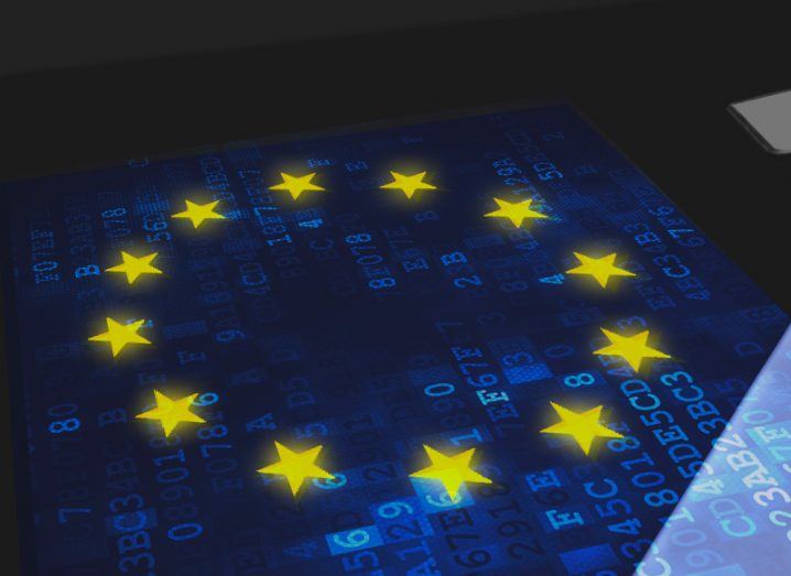 Illustration of a digital EU flag on a table with small numbers and letters visible on it.
