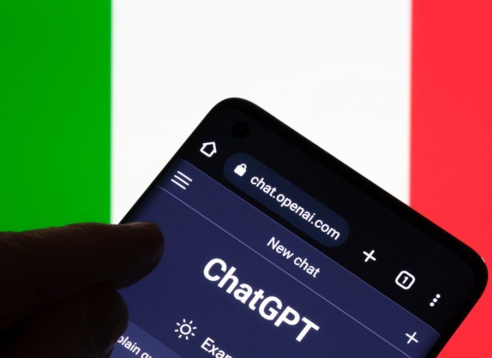 The ChatGPT icon on the OpenAI website, on a smartphone with the flag of Italy in the background.