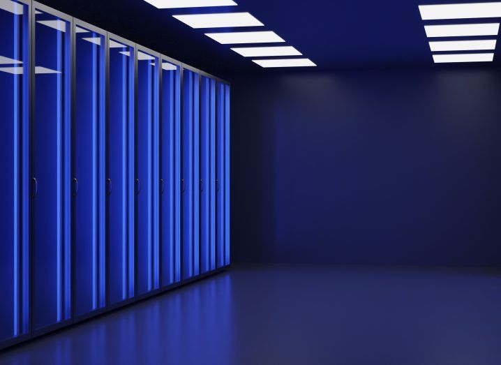 The inside of a data centre in neon blue lighting.