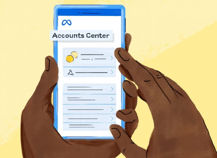 Illustration of a hand holding a smartphone that reads Accounts Center.