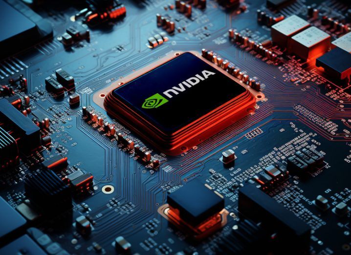The Nvidia logo on a computer chip in the middle of a motherboard. Used to represent AI chips.