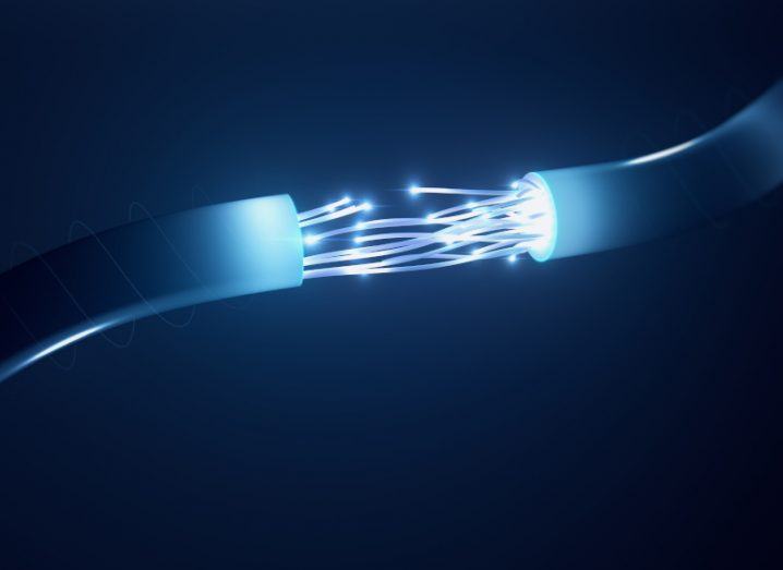 A rendered image of two blue subsea fibre cables lit up about to connect.