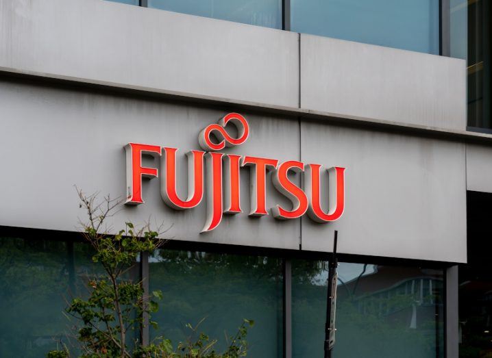 The Fujitsu logo on the front of a building.