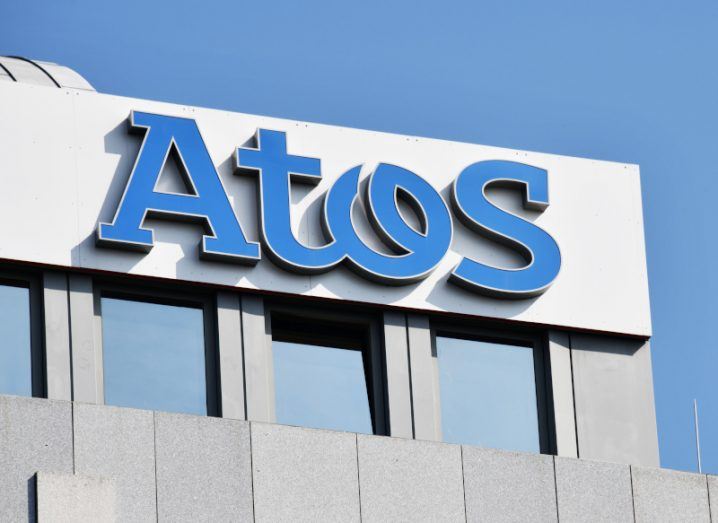 The Atos logo on the side of a building.