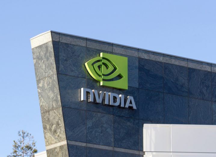 The Nvidia logo on the side of a tall building.